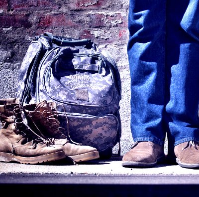 army boots, jeans, and a backpack